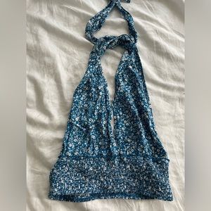 NEVER WORN blue with white flowers patterned halter top.